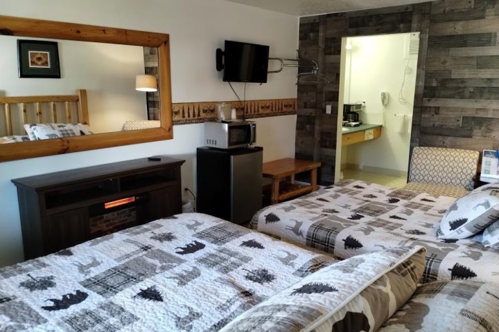 a bedroom with a bed in a room