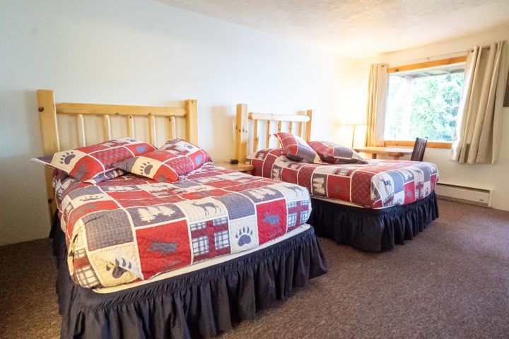 a bedroom with a bed in a room