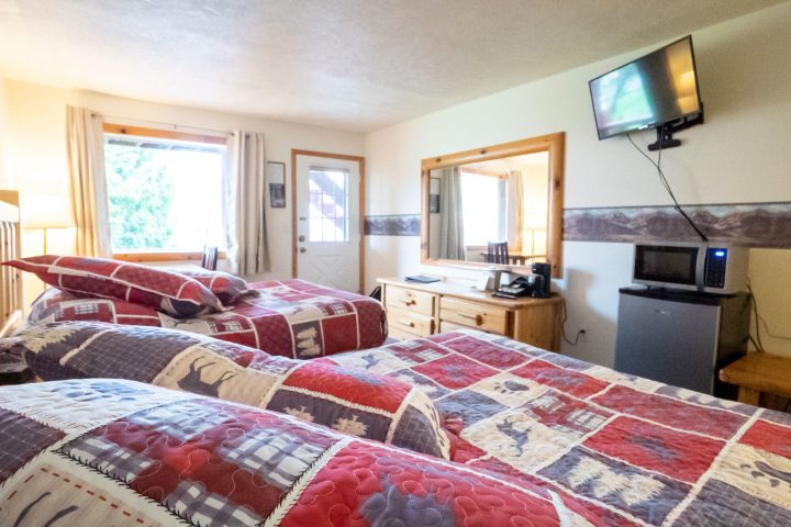 a bedroom with a large bed in a room