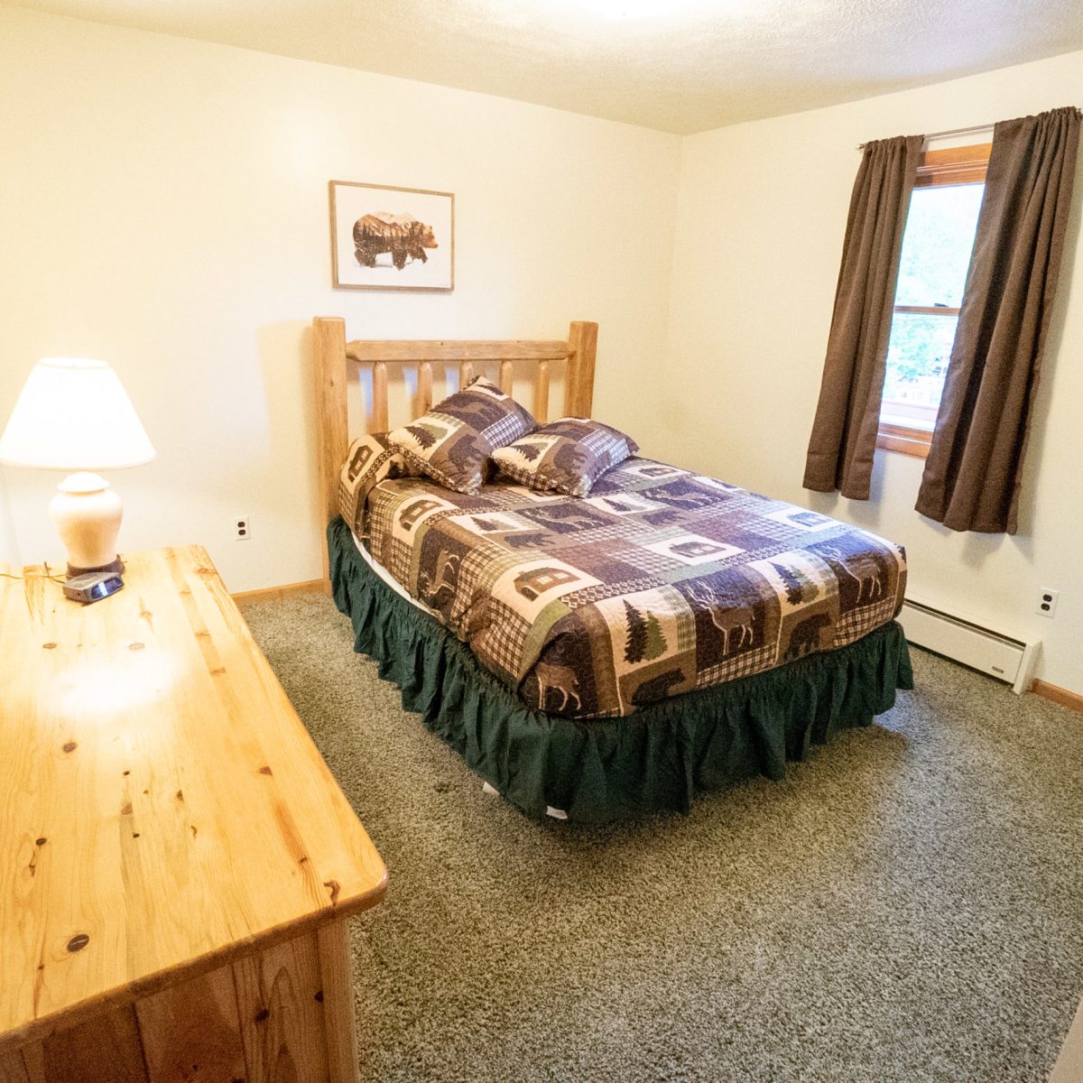 a bedroom with a bed in a room