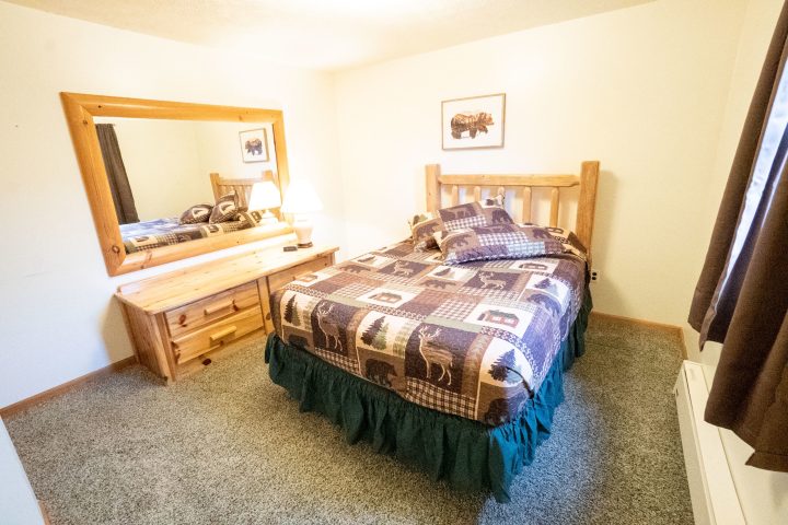 a bedroom with a bed in a room