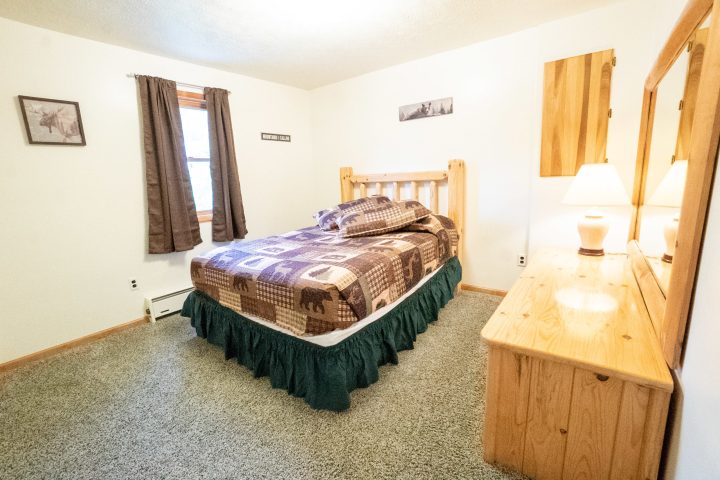 a bedroom with a bed in a room