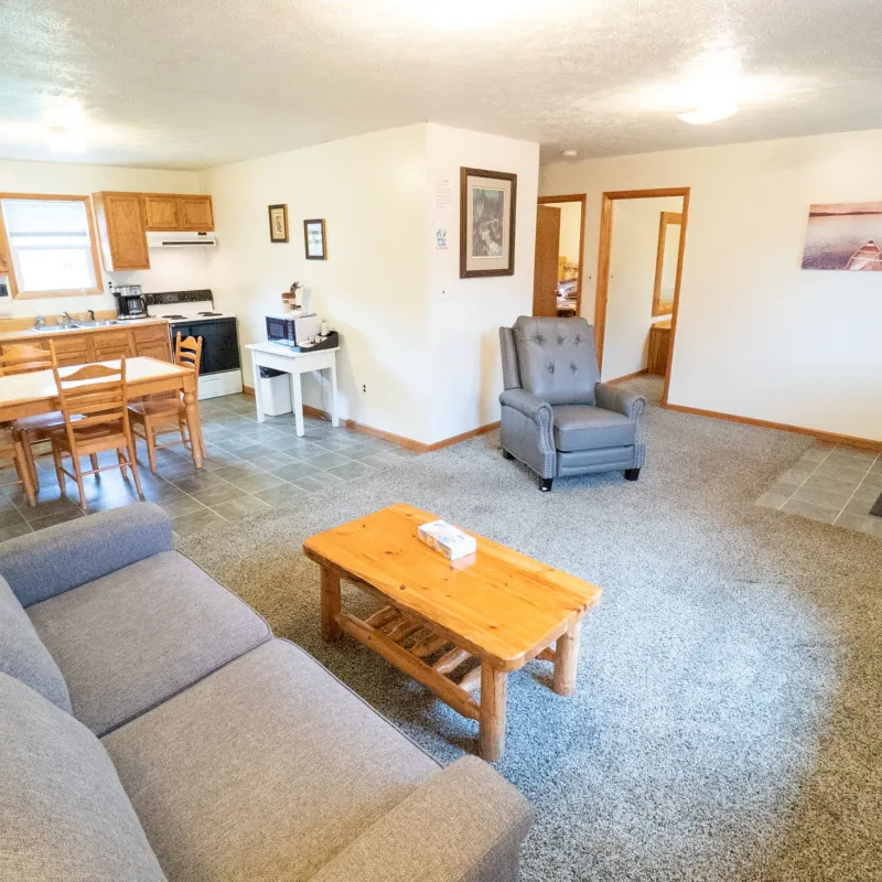 a living room filled with furniture on top of a wooden chair
