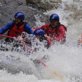 People encompassed by white water rapids