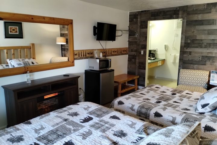 a bedroom with a bed in a room