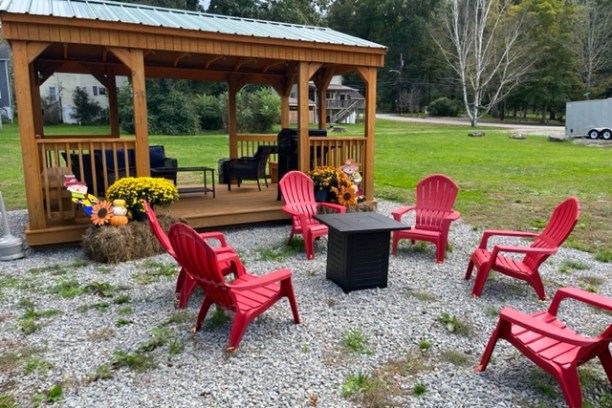 a group of lawn chairs sitting on top of a picnic table