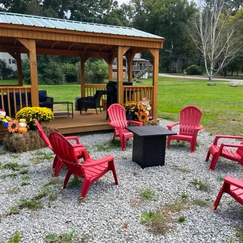 a group of lawn chairs sitting on top of a picnic table