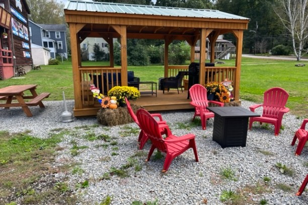 a group of lawn chairs sitting on top of a picnic table